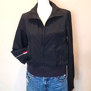 Dark navy blue Tommy Hilfiger windbreaker jacket.